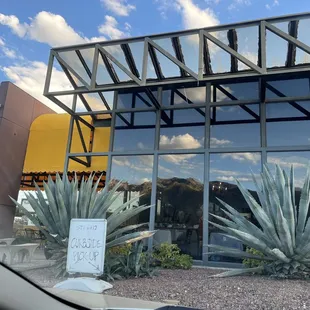 the reflection of a building in the windows
