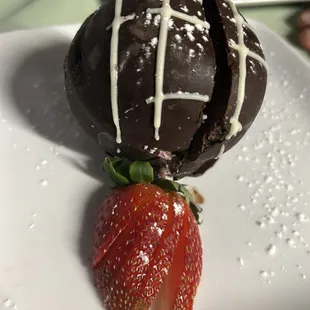 a strawberry on a plate