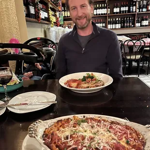 a man sitting at a table in a restaurant