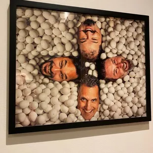 a group of men surrounded by eggs