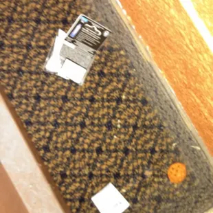 empty condom box and cheetos and trash