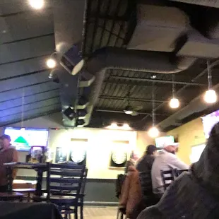 a man sitting at a table in a restaurant