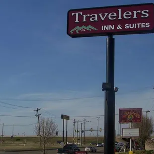 MH TravelersInn Suites Oklahoma City Sign