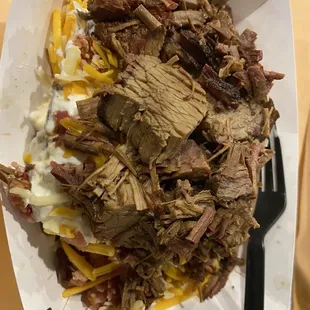 ulled pork and cheese in a paper container
