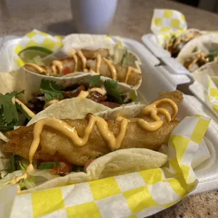 two tacos in a styrofoam container