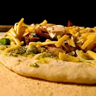 an uncooked uncooked pizza