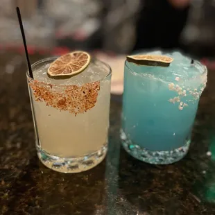 two cocktails on a table
