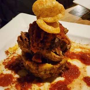 Mofongo with pork and topped with chicharron, representing Puerto Rico, Mexico, and Dominican Republic