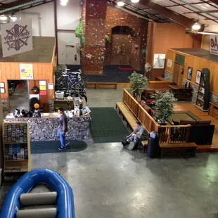 Rock wall, rental counter, and  lounge.