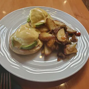 Eggs Benedict with house potatoes (had onions in it)