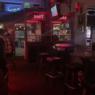 a group of people sitting at a bar