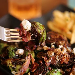 Fried Brussels sprouts tossed in balsamic reduction w/blue cheese and bacon