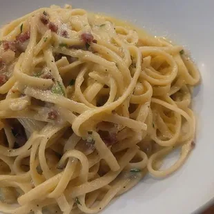 carbonara - Umbria linguine tossed in a sauce made with egg, fresh parmesan, and crispy pancetta