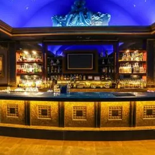a bar with a blue ceiling