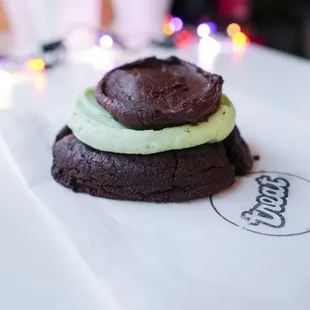 Alicia -A chocolate brownie sugar cookie topped with layers of mint &amp; chocolate buttercream frosting. (September special)