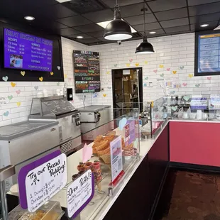 a bakery counter with a variety of pastries