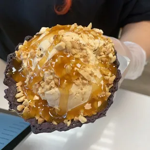 a person holding a dessert