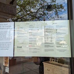 a sign in the window of a restaurant