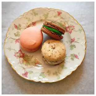 three macarons on a plate