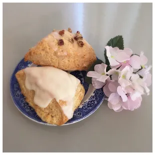 a plate of scones and a flower