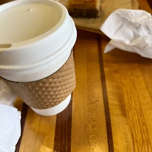 a cup of coffee and a pastry
