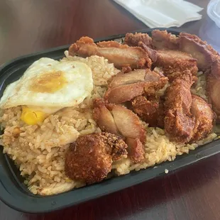 Indonesian Fried Rice ($14.95 dinner plate) with regular chicken, fried chicken, and a small egg on top -- 5 August 2024