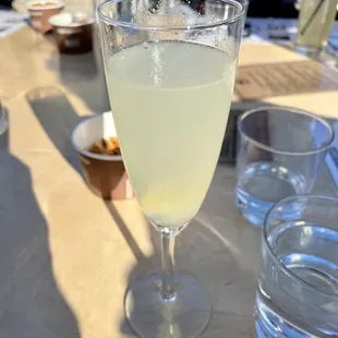 French 75 (earl grey tea flavored gin, fresh squeezed lemon juice, simple syrup, Prosecco). Not bad. The juniper was strong!