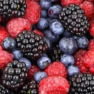 a close up of a pile of berries
