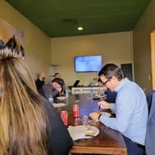 a group of people sitting around a table