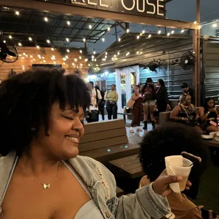 a woman holding a cup of coffee