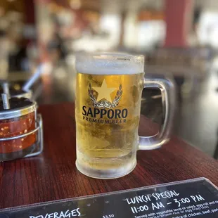 a glass of beer on a table