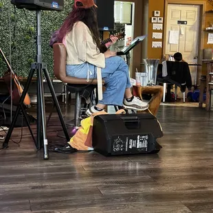 a man and a woman sitting on a chair