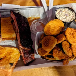 Rib sandwich, side of slaw, basket of fried pickles
