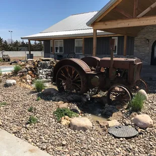 an old tractor in front of a house