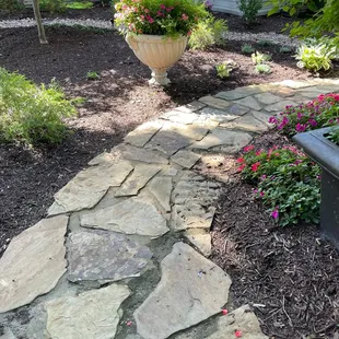 a stone path in a garden