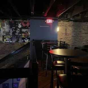 tables and chairs in a dimly lit room