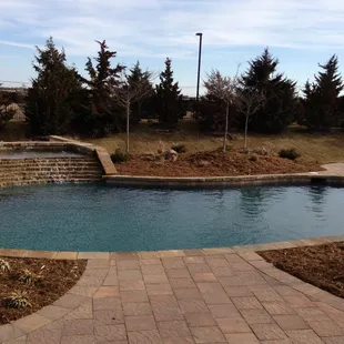 A finished gunite pool with an awesome water feature!