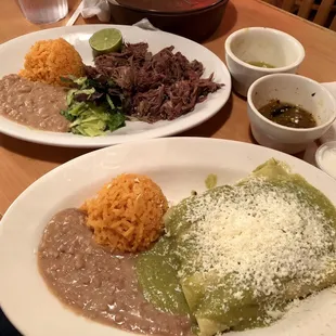 Enchiladas with salsa verde (front) and barbacoa de borrego (steamed lamb platter) in the back