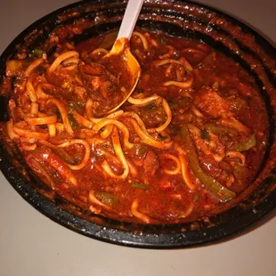 a bowl of spaghetti and meat