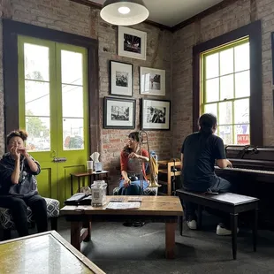 a group of people sitting around a coffee table