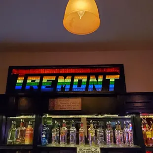 the neon sign above the bar