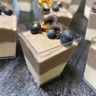 individual desserts with blueberries and pretzels