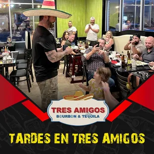 a man serving food to a group of people