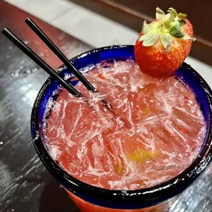 a drink with strawberries on top