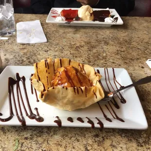 Fried ice cream and cheese cake across the table