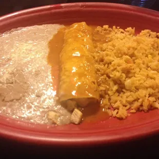 Chicken enchilada with re fried beans and rice