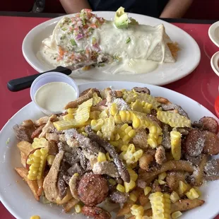 Salchipsapa Mixta (foreground) Burrito Mexicana
