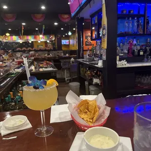 Chips and queso + my chosen salsa mixed in and w/a house margarita on the rocks with salt