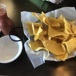 Warm chips and flask of salsa