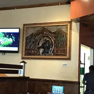 a man sitting at a table in a restaurant